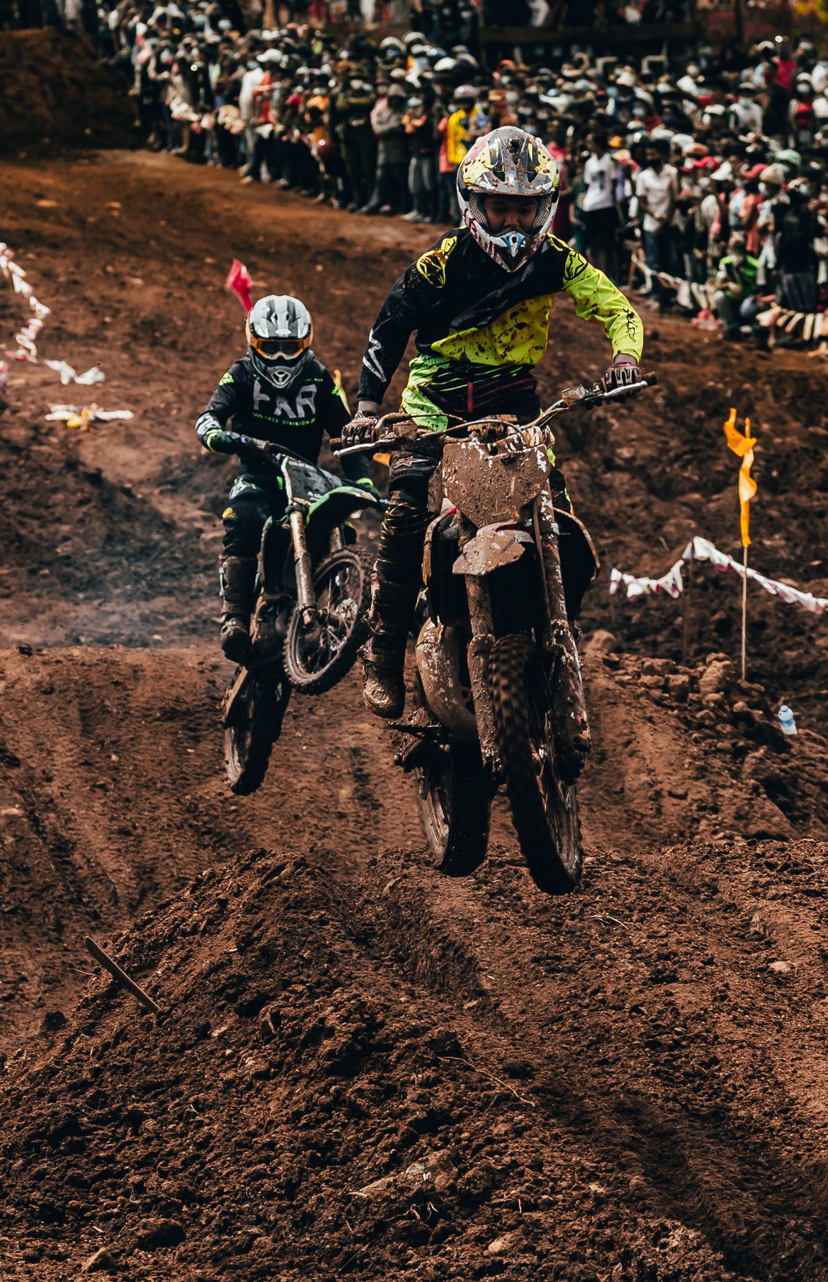 Motocross riders on a dirt track