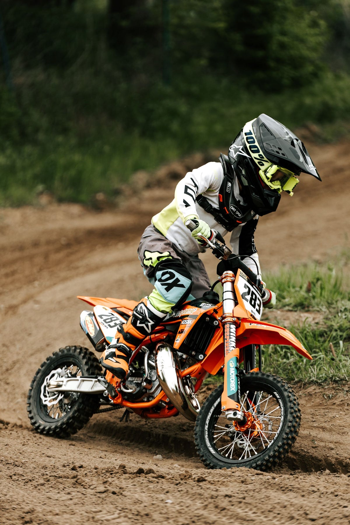 Kid racing a dirt bike